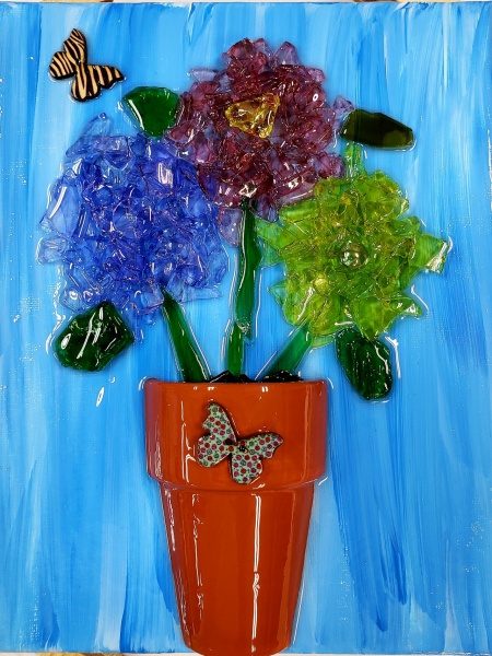 Clay pot with Flowers with shattered glass