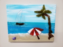 Beach scene with umbrella made with shattered glass